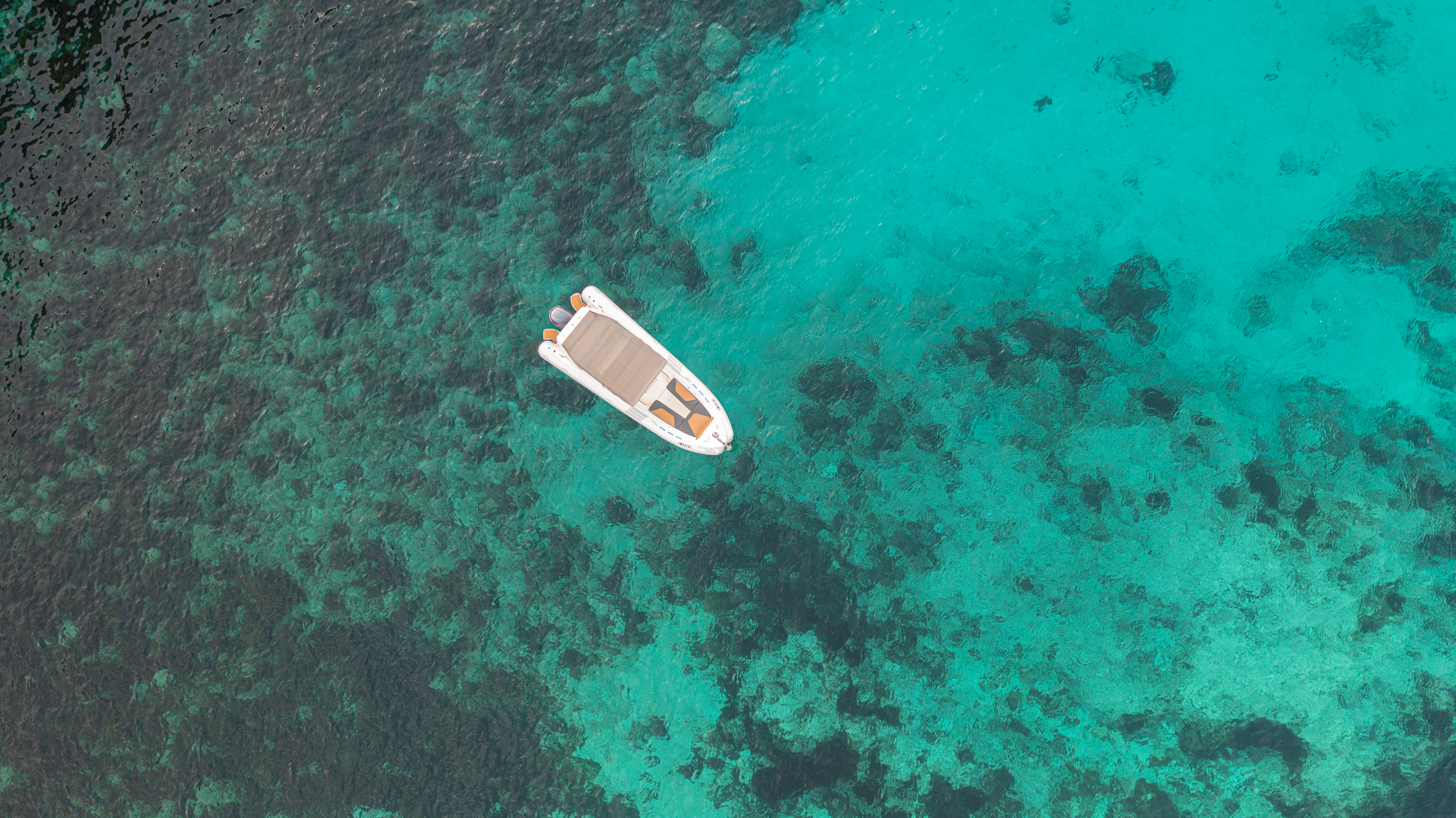 Malta private boat tours on a beautiful beach with crystal-clear water.