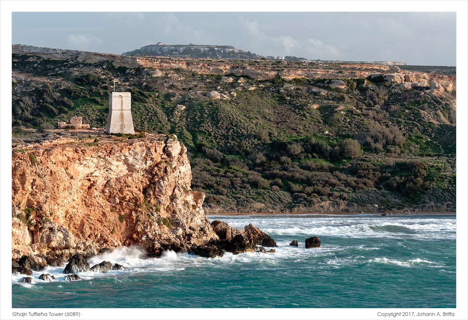 Għajn Tuffieħa Tower (Lippija Tower) perched on the cliff above Golden Bay