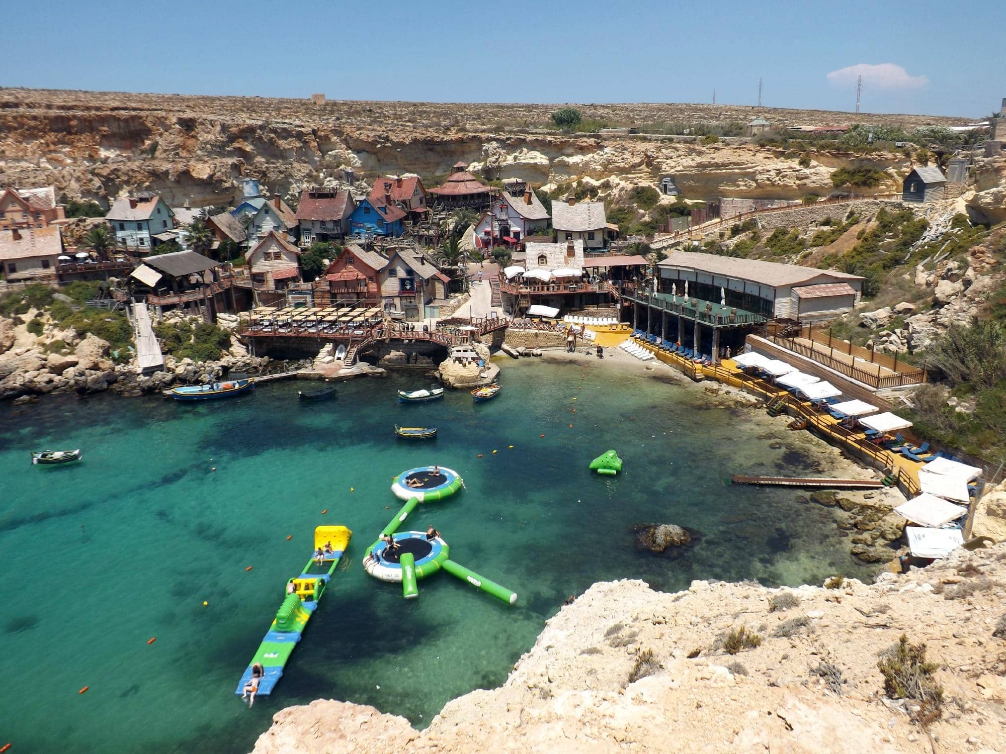 malta-popeye-village Colourful wooden buildings of Popeye Village, Malta