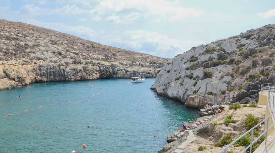 Hidden Swimming Spots in Malta featuring quiet coves and secluded beaches explored by boat