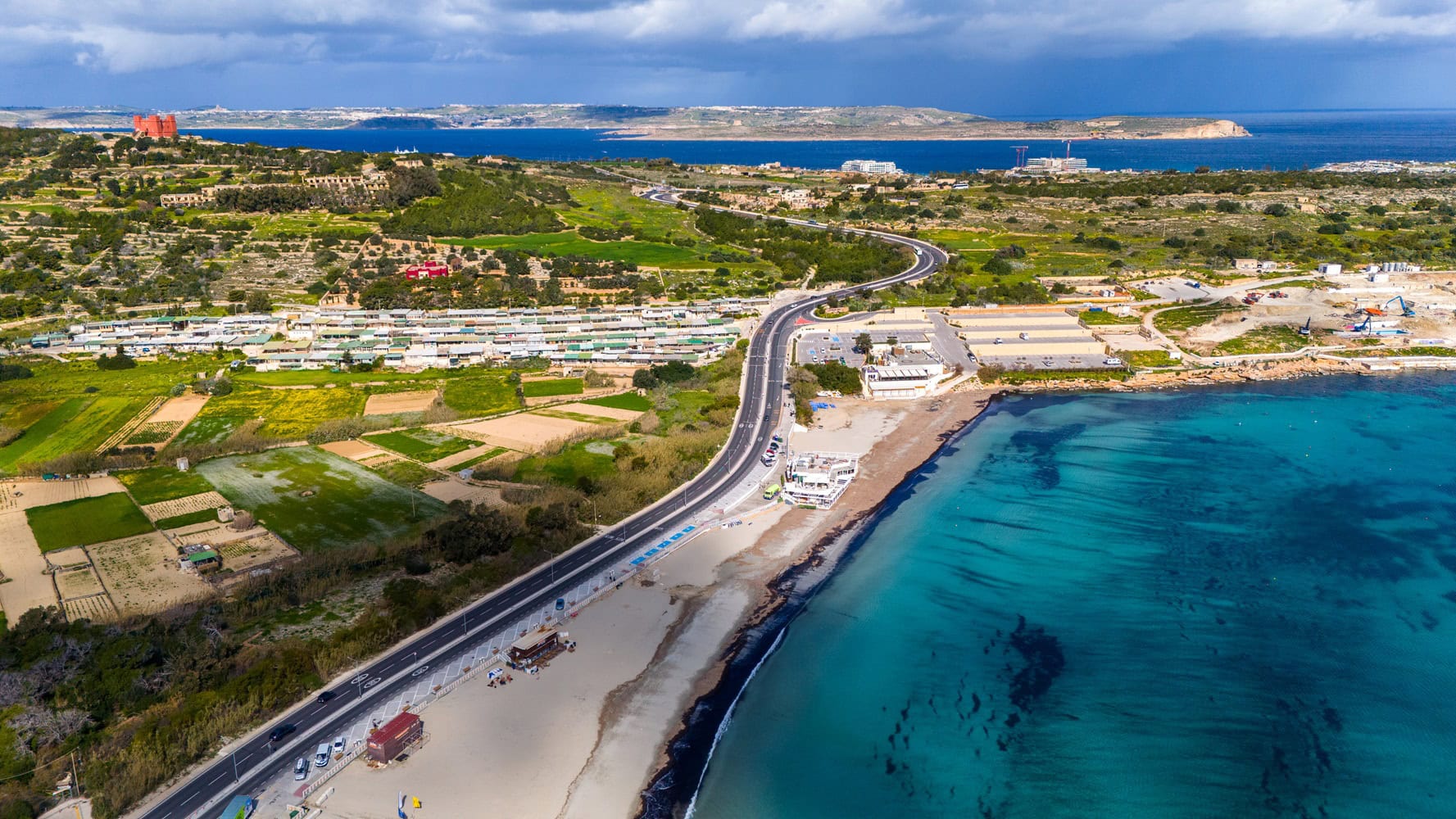 Scenic view of Ghadira Bay Malta with crystal-clear turquoise water and sandy beach