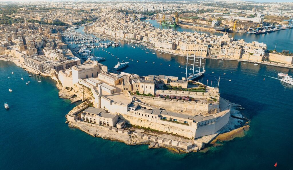Aerial view of Valletta, Malta, with historic fortifications, marina, and waterfront, highlighting top attractions and cultural landmarks for travellers exploring things to do in Valletta.