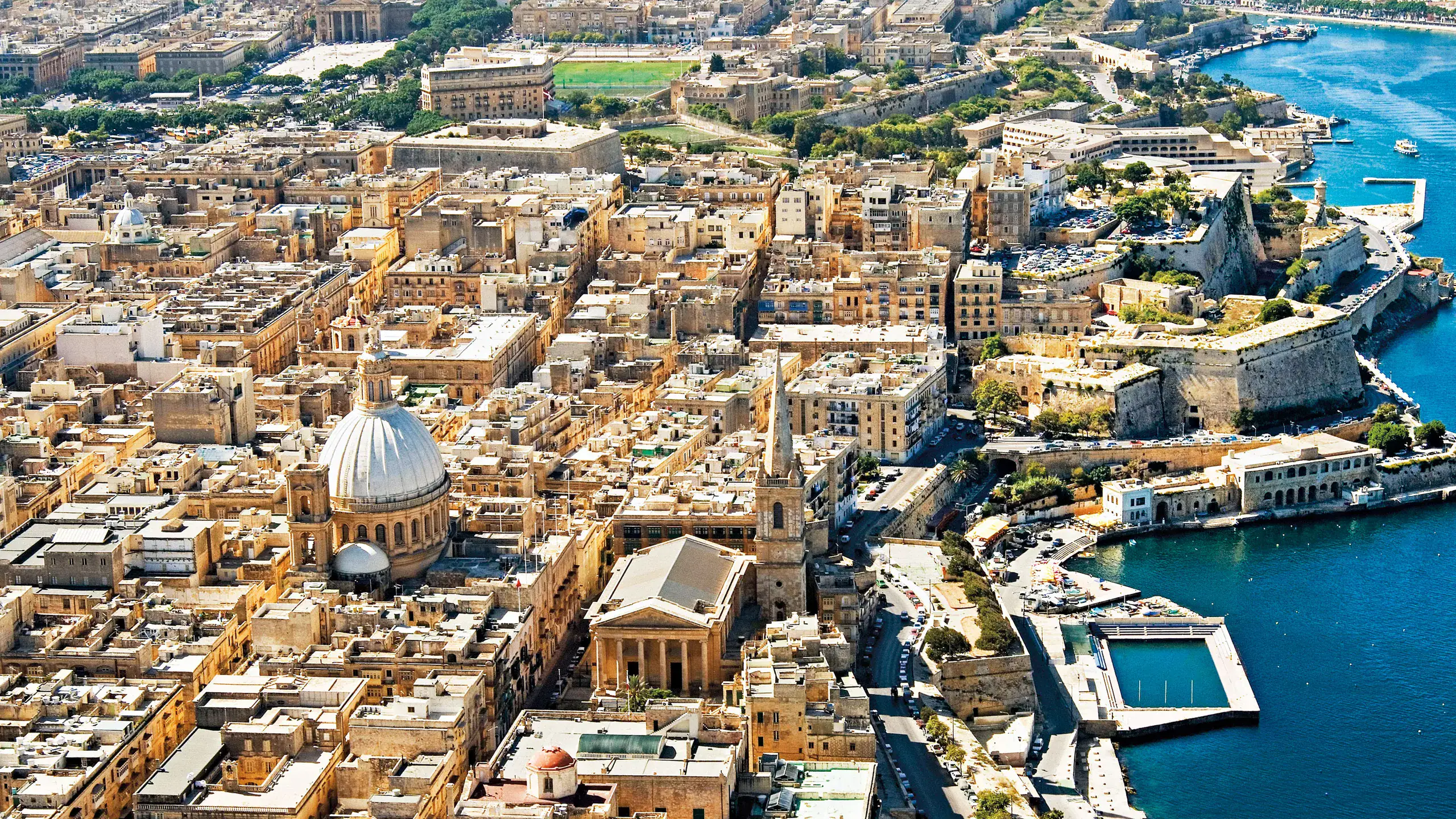 Aerial view of Valletta, Malta showcasing its historic cityscape, harbours, and limestone architecture — a must-see highlight for any Malta itinerary.