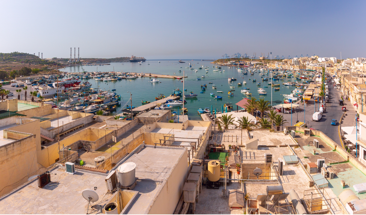 GOZOblu private boat tour arriving by sea at Marsaxlokk Fishing Village for a unique coastal experience