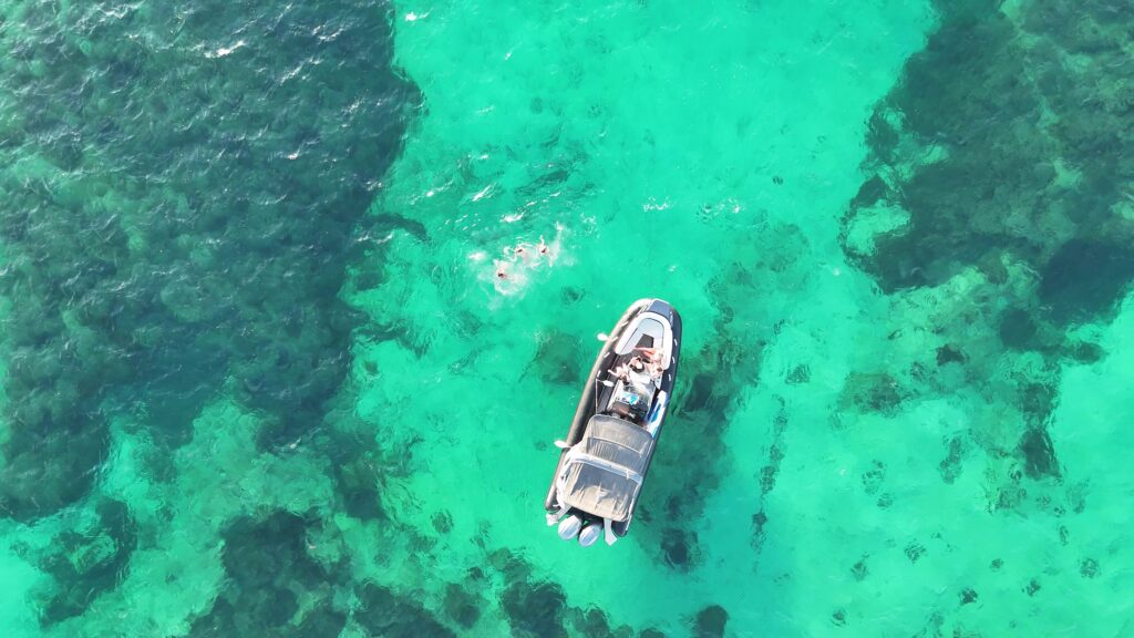 Friends enjoying boat tours in Malta while exploring the coast and hidden bays