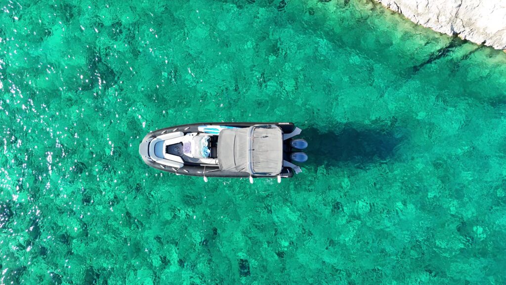 A private bout tour cruising in the sea, one of the best summer activities in Comino
