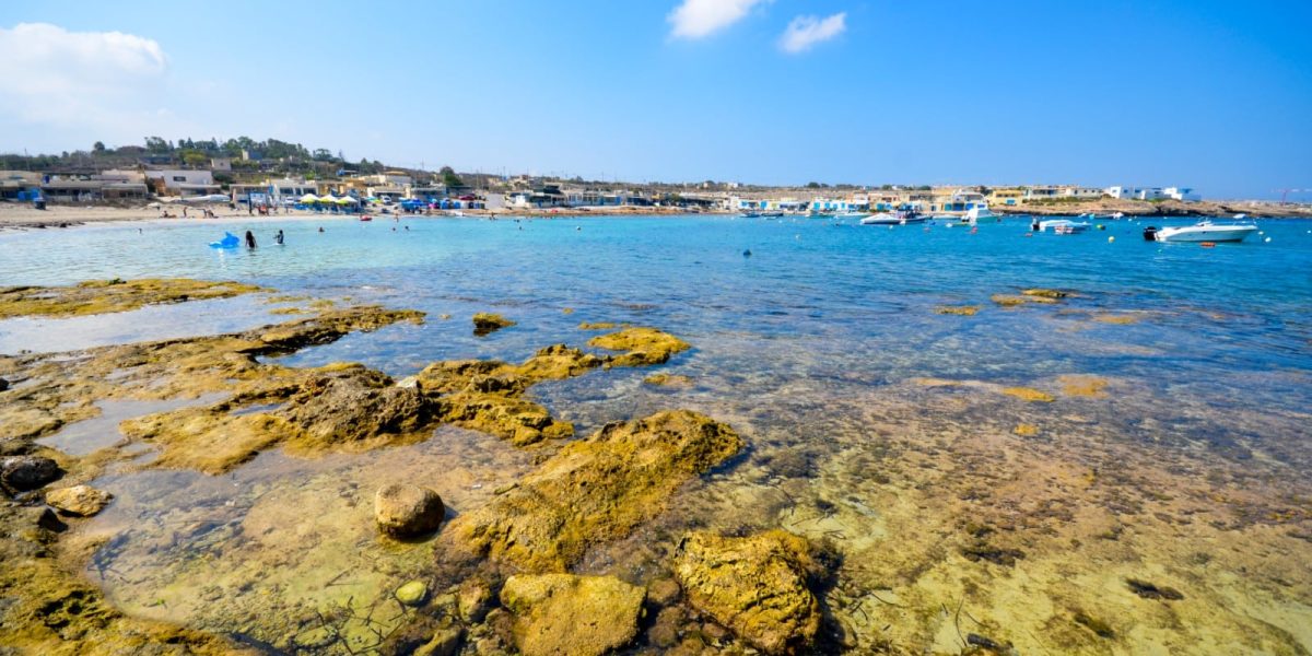 Armier Bay Malta Scenic view of Armier Bay Malta with crystal-clear turquoise waters and rocky coastline