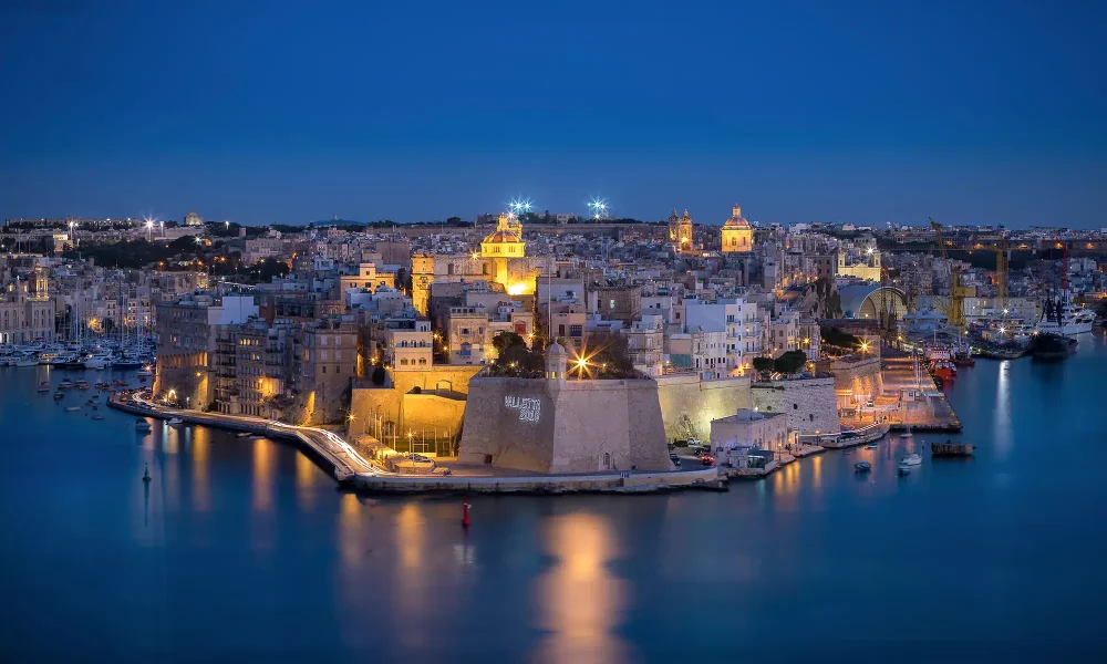 Scenic view of Malta Grand Harbour with historic fortifications and blue waters, a highlight featured in our Malta travel guide.