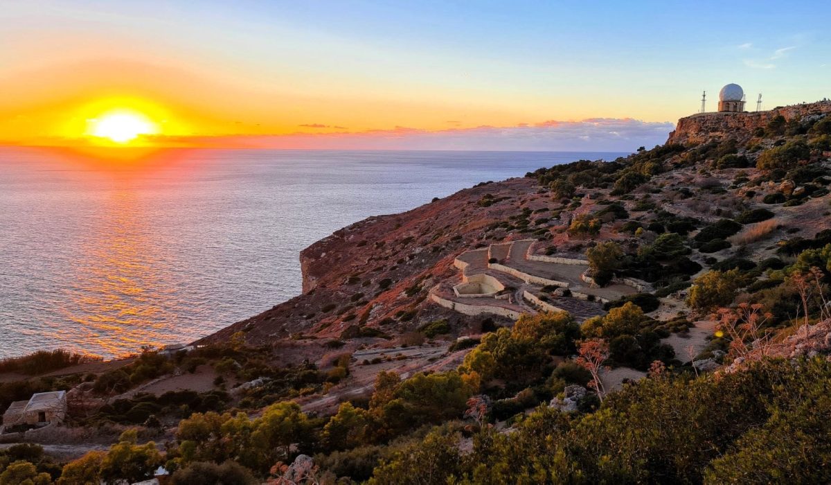Breathtaking sunset view over Dingli Cliffs Malta with golden skies and panoramic sea horizon